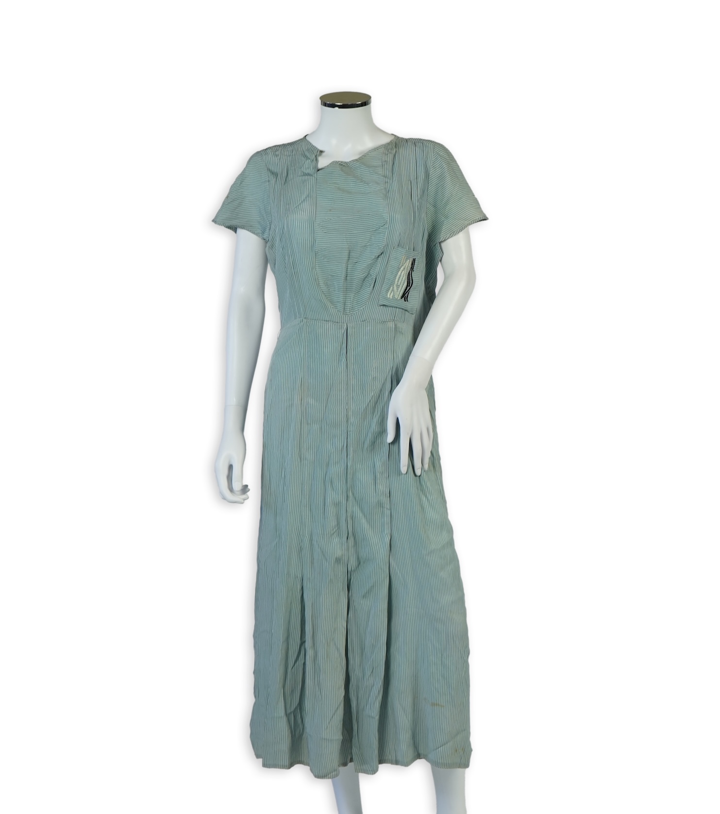 Two 1930's printed silk crepe summer day dresses together with a similar pale blue and black stripped summer day dress., Condition - the maroon and cream dress has damage to one sleeve, the green dress has worn under the